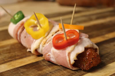 Bacon Wrapped chicken breast with colorful pepper rings